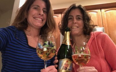 Sisters Sharing Wine Made By Sisters